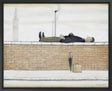 A painting by LS Lowry depicting a man lying flat on his back atop a brick wall, dressed in dark clothing with hands clasped on his chest. Below the wall on the pavement are a closed black umbrella and a small suitcase labelled "L.S.L." In the background, an industrial chimney emits smoke, and a clock tower is faintly visible against a pale sky.